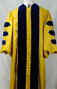 Gold doctoral gown with blue velvet panels and bars by University Cap & Gown